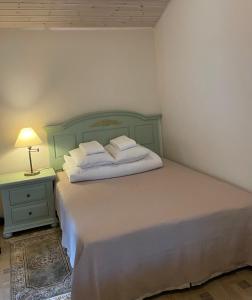 Кровать или кровати в номере Namukas Kunigiškėse