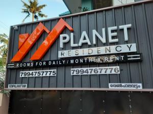 znak rezydencji planety w budynku w obiekcie PLANET RESIDENCY w mieście Thiruvananthapuram