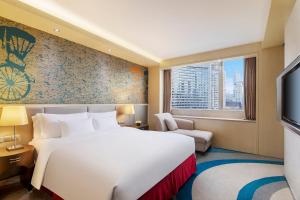 a hotel room with two beds and a window at Radisson Collection Hyland Shanghai in Shanghai
