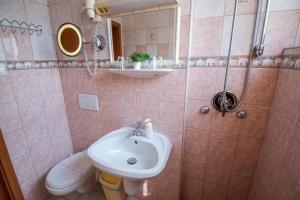 a bathroom with a sink and a toilet at Richter Pansion in Budapest
