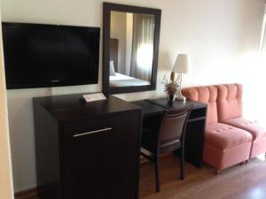 TV a/nebo společenská místnost v ubytování Hotel Paiva