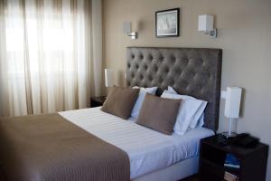 Postel nebo postele na pokoji v ubytování Hotel Paiva