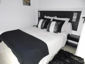 Cama o camas de una habitación en HOTEL TERRA GALEGA MEIGA