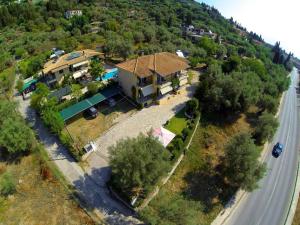 an aerial view of a house on a road at Alexia Studios in Nydri