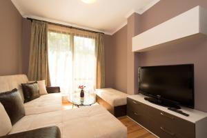 A television and/or entertainment centre at Holiday Village Lozenets