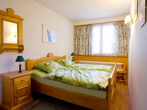 a bedroom with a bed and a window at Apartment Zinal 201 by Interhome in Les Collons