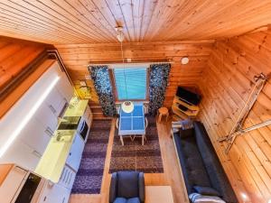 an overhead view of a kitchen and living room in a tiny house at Holiday Home Lähikaltio 329 by Interhome in Äkäslompolo