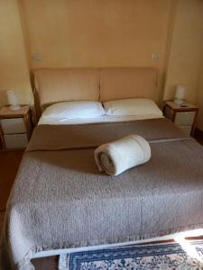Postel nebo postele na pokoji v ubytování L'Oleandro sul Lago d'Iseo B&B