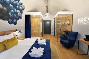 Posteľ alebo postele v izbe v ubytovaní 1552 Boutique Hotel