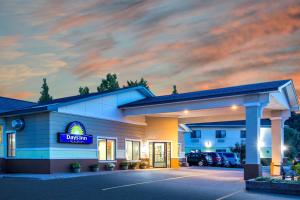 a front view of a hotel with a sign at Days Inn by Wyndham Marquette in Marquette