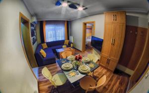 a kitchen and living room with a table and chairs at CONCEPT HoUSE in Ankara