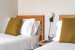 A bed or beds in a room at Aspasios Garden Apartments
