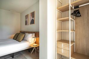 A bed or beds in a room at Aspasios Garden Apartments