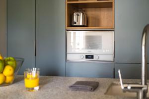 A kitchen or kitchenette at Aspasios Garden Apartments