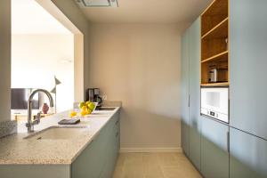 A kitchen or kitchenette at Aspasios Garden Apartments