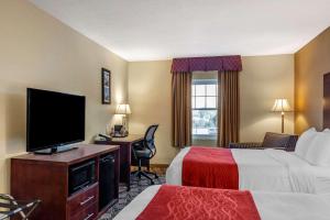 a hotel room with a large bed and a television at Comfort Inn Rockland - Boston in Rockland