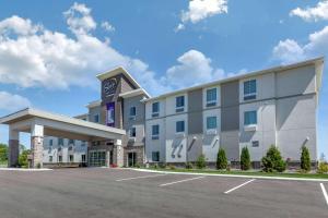 a hotel with a parking lot in front of it at Sleep Inn & Suites Lancaster-Platteville in Lancaster