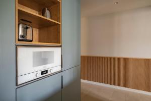 A kitchen or kitchenette at Aspasios Garden Apartments