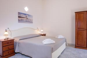 Кровать или кровати в номере Orosei Summer Holidays - Cala del Turco green house