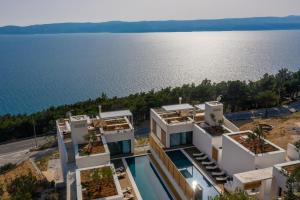 an aerial view of a building by the water at Villa Bura in Marusici 