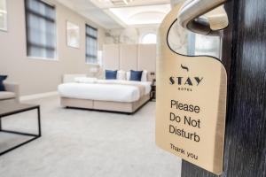 Postel nebo postele na pokoji v ubytování Stay Hotel