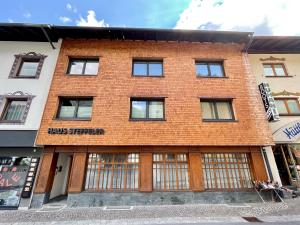 a red brick building with the words mass shepherd at Haus Steffeler in Sankt Anton am Arlberg