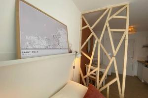 a room with a wooden partition with a sliding door at Héol in Saint Malo +18 photos