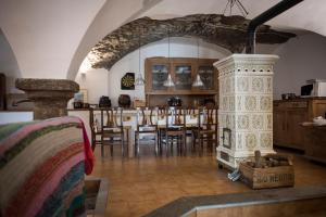 a kitchen and dining room with a table and a fireplace at Sci e montagna vera in Pragelato