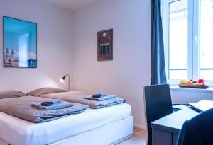 Llit o llits en una habitació de HITrental Central Station Apartment