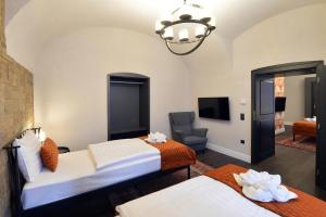 Posteľ alebo postele v izbe v ubytovaní 1552 Boutique Hotel