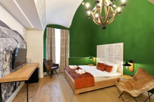 Posteľ alebo postele v izbe v ubytovaní 1552 Boutique Hotel