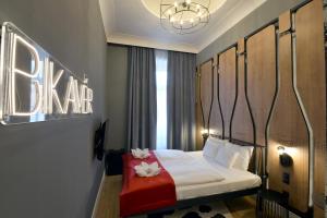 Posteľ alebo postele v izbe v ubytovaní 1552 Boutique Hotel