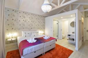 Posteľ alebo postele v izbe v ubytovaní 1552 Boutique Hotel