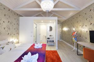 Posteľ alebo postele v izbe v ubytovaní 1552 Boutique Hotel