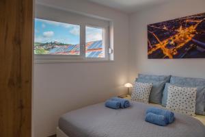 A bed or beds in a room at Zsuka apartman free parking