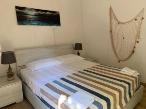 Postel nebo postele na pokoji v ubytování Villaggio Benvivere