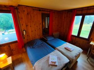 Cama ou camas em um quarto em Chalet du Mont Lozère