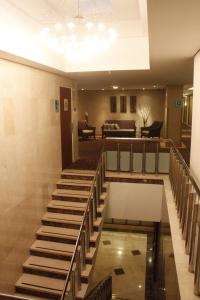 a lobby with stairs and a living room at Eurobuilding Express Maracay in Maracay
