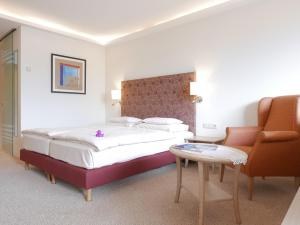 Posteľ alebo postele v izbe v ubytovaní ALPIN- Das Sporthotel, SUMMERCARD included May - September