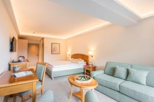 Posteľ alebo postele v izbe v ubytovaní ALPIN- Das Sporthotel, SUMMERCARD included May - September