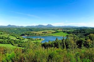 a view of a lake from a hill at Studio cosy Yssac-la-Tourette in Yssac-la-Tourette