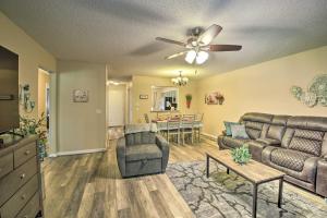 a living room with a couch and a table at Hot Springs House with Spacious Deck and Grill! in Hot Springs Village