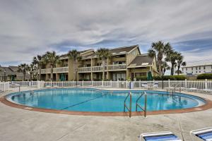 a large swimming pool in front of a building at Stewart House in the Beautiful SeaScape Resort in Destin