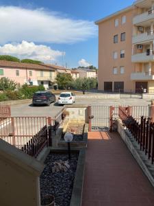a car parked in a parking lot next to a building at Balo’s home in Venturina Terme