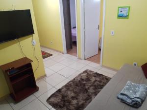 Televízia a/alebo spoločenská miestnosť v ubytovaní Sobrado Livramento Rivera Diaria