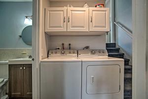 a kitchen with a white stove and a dishwasher at Walk to Beach Quaint Dennis Home with Deck and Grill! in Dennis +38 photos