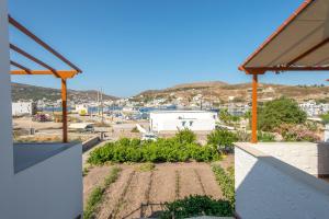 a view of a garden from a house at Stefanos Studios in Skala