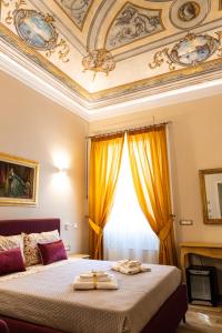 a bedroom with a large bed with a ceiling at Residenza Di Nucci in Termoli