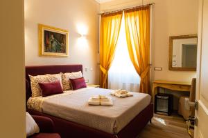 a bedroom with a bed with two trays on it at Residenza Di Nucci in Termoli