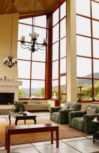 a large living room with large windows at La Morada del Sol in Tausa Viejo